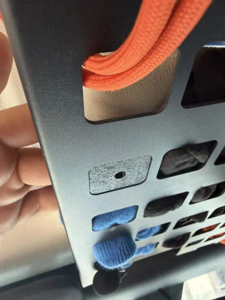 The backer plate in place behind a panel slot