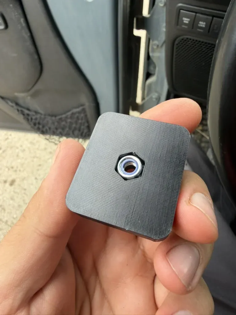The printed backer plate that holds the captive nut