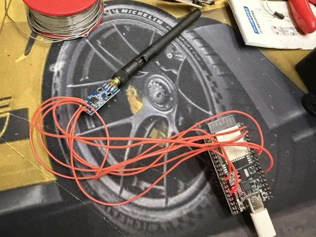 The CC1101 and the ESP32 wired with jumpers on the bench, before going into the case