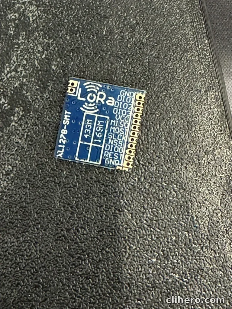 The XL1278-SMT LoRa module, a small blue board with the pin names printed along one edge and a 433M / 169M frequency marking